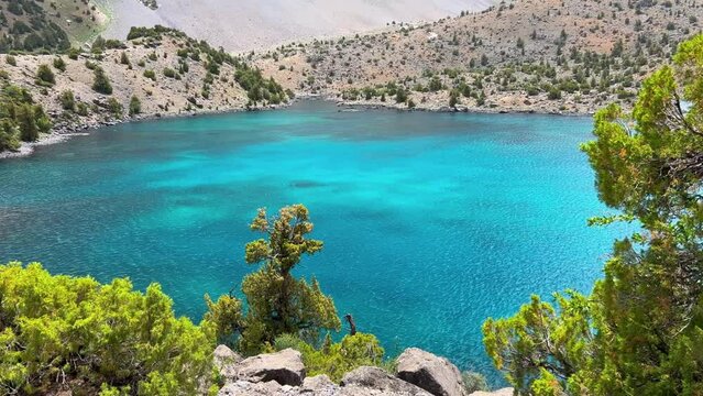 The Alaudin (Chapdara) lakes, lying at an altitude of 2800 m, are considered one of the most beautiful lakes of the Fan Mountains. Turquoise mountain lake. Pamiro-Alai. Tajikistan, Pamir 4K