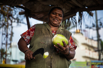 Street Corner Charm: Indian Lady with Coconut Cart