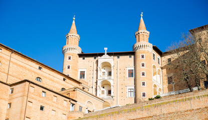Fototapeta na wymiar Bottom view of the Ducal Palace in Urbino, Marche, Italy. It is the main monument of the city. It was an important center of the Italian Renaissance and the entire structure is a world heritage site.