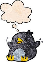 cartoon penguin and thought bubble in grunge texture pattern style