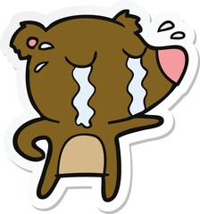 sticker of a cartoon crying bear
