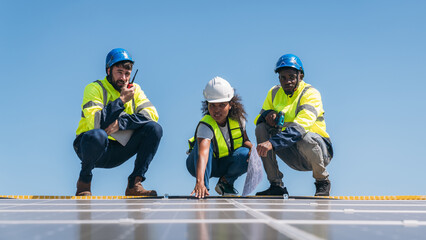 Fototapeta premium Service engineer checking solar cell on the roof for maintenance if there is a damaged part. Engineer worker install solar panel. Clean energy concept.