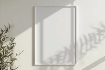Fotobehang White rectangular vertical frame hanging on a white wall mockup © ERiK