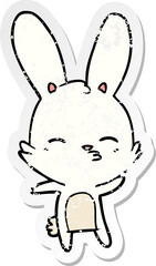 distressed sticker of a curious bunny cartoon