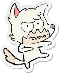 distressed sticker of a cartoon grinning fox