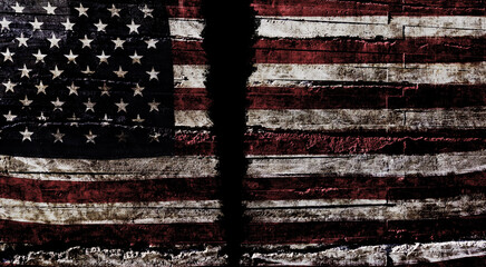 Distressed American flag torn in two representing division in US politics and the threat to...