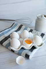 Fototapeta na wymiar eggs ready for cooking on light kitchen table, hight key