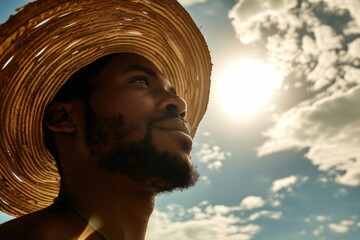 Bottom view, Handsome african american Man with straw hat under Sun, Summer Vacation. Enjoy summer holidays, outdoor portrait of relaxing young black man traveler bottom view