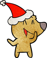 laughing bear textured cartoon of a wearing santa hat