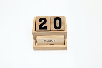 20th of August wooden perpetual calendar. Shot close up isolated on a white background