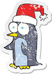 retro distressed sticker of a cartoon christmas penguin