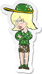 retro distressed sticker of a cartoon woman in uniform