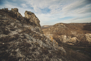 landscape with rocky mountains formation rock in the wild. Rocky cliff. Steep cliff of high mountain. Nature background, geological structure. Marble rocks in the wild. Stone Pattern