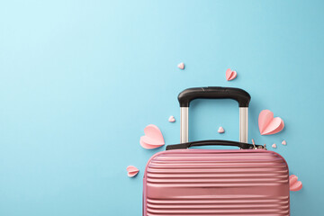 Starlit serenade: romantic escapes for couples. Top view shot of baggage, pink hearts on pastel blue background with advert area