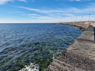 Fototapeta premium Walking the Arrecife, Lanzarote seaside promenade offers a blend of coastal charm and Canarian architecture.