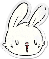 distressed sticker of a cartoon rabbit face