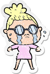 distressed sticker of a cartoon crying woman wearing spectacles