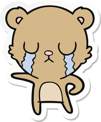 sticker of a crying cartoon bear