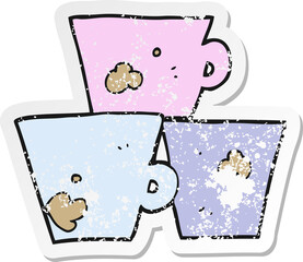 retro distressed sticker of a cartoon stack of coffee cups