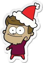 sticker cartoon of a happy man wearing santa hat