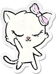 distressed sticker of a cute cartoon cat with bow