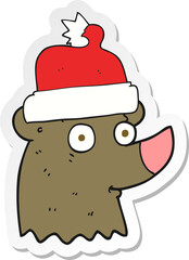 sticker of a cartoon bear wearing christmas hat