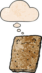 cartoon biscuit and thought bubble in grunge texture pattern style