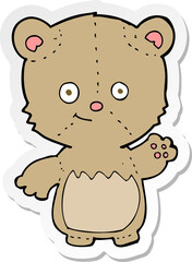 sticker of a cartoon teddy bear waving