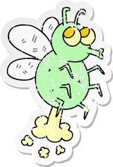 distressed sticker of a quirky hand drawn cartoon fly