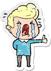 Obraz premium distressed sticker of a cartoon crying man