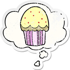 cartoon cupcake and thought bubble as a distressed worn sticker