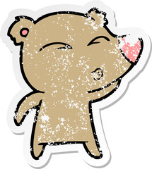 distressed sticker of a cartoon whistling bear