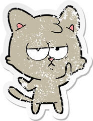 distressed sticker of a bored cartoon cat