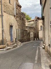 Fototapeta na wymiar A Cobblestone Street Cityscape Arles, France 