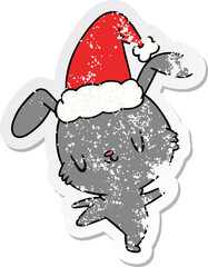 christmas distressed sticker cartoon of kawaii rabbit