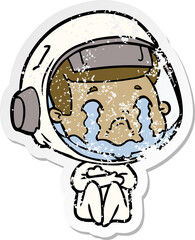 distressed sticker of a cartoon crying astronaut