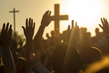 Christians with hands raised in praise, worship and prayer to God at sunrise
