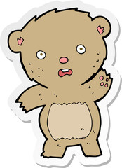 sticker of a cartoon unhappy teddy bear