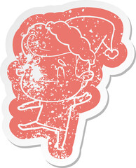 happy cartoon distressed sticker of a man wearing santa hat
