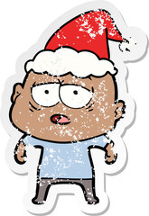 distressed sticker cartoon of a tired bald man wearing santa hat