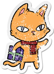 Obraz na płótnie Canvas distressed sticker of a cartoon cat with gift