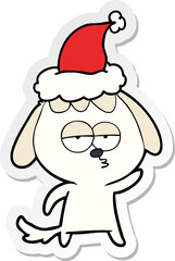 sticker cartoon of a bored dog wearing santa hat