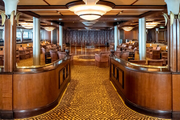 Royal Caribbean Cruise Line (NCL) Jewel of the Sea cruise ship interior. The Safari Club, entertainment area is empty with no people.  - obrazy, fototapety, plakaty