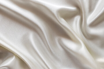 Luxury satin background in milky light colours.