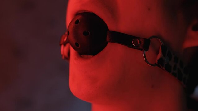 Man's mouth covered with a gag, close-up