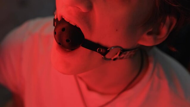 Man's mouth covered with a gag, close-up