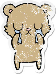 distressed sticker of a crying cartoon bear