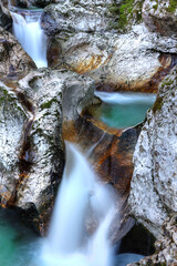 Mountain river Lepenica, left tributary of the river Soča in the Triglav national park, Bovec, Slovenia. Small waterfall, long exposure.