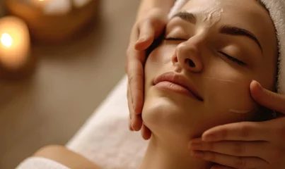 Crédence de cuisine en verre imprimé Spa Beautiful young woman having a facial massage at the spa salon. Beauty treatment concept.