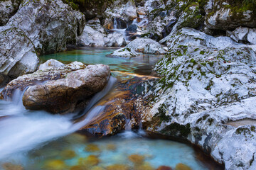 Mountain river Lepenica, left tributary of the river Soča in the Triglav national park, Bovec, Slovenia. Small waterfall, long exposure.